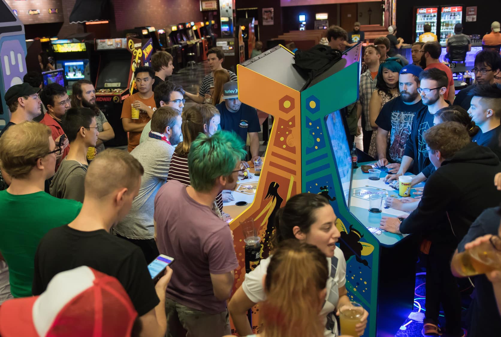 Gamers play a Killer Queen cabinet at the game's 2016 