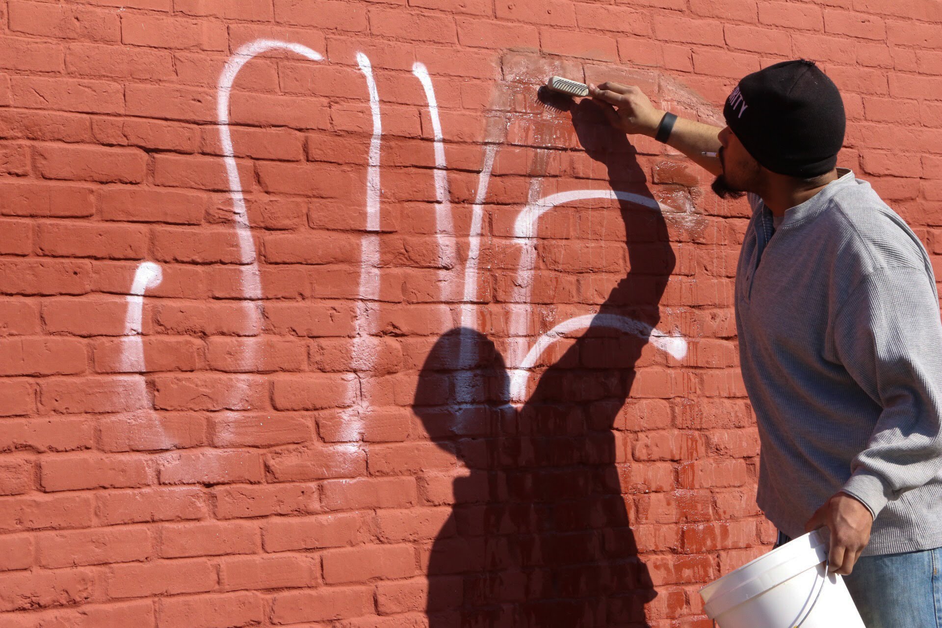 Graffiti removal in progress on Willy Street.