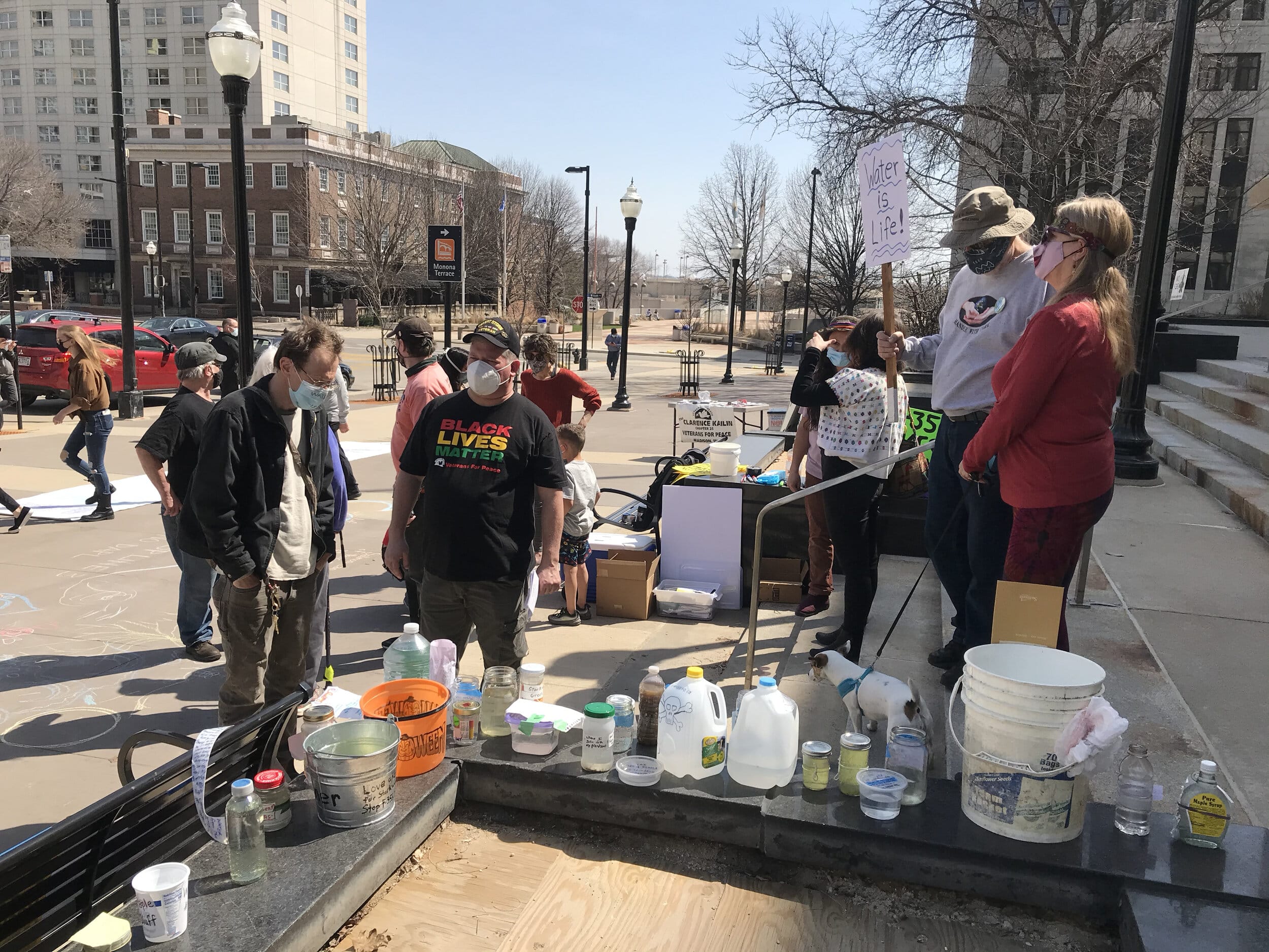 Jars of water accumulated as friends and neighbors gathered for 