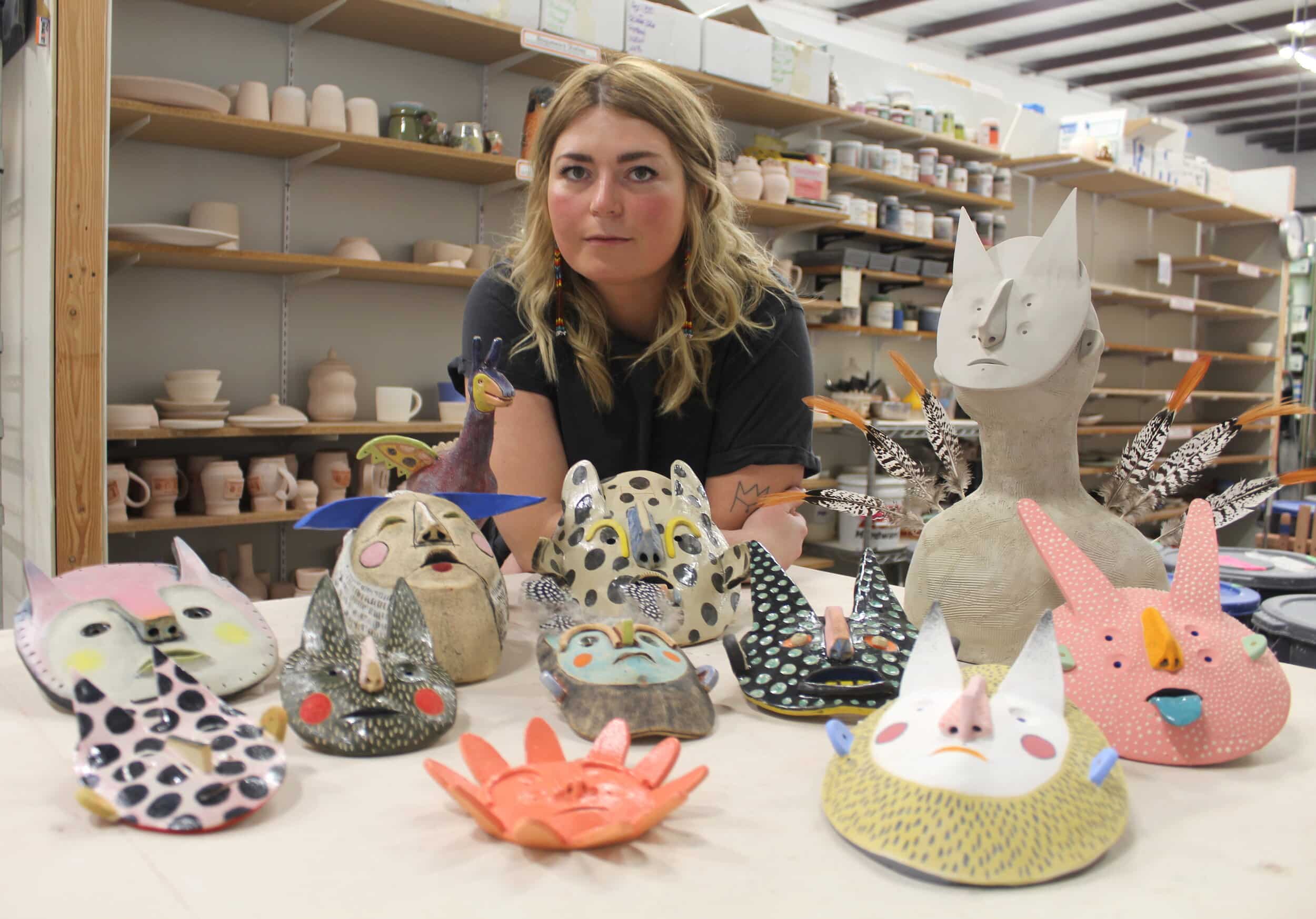 Karolina Romanowska with some of her work at Midwest Clay Project & Studios. Photo by Elizabeth Lang.