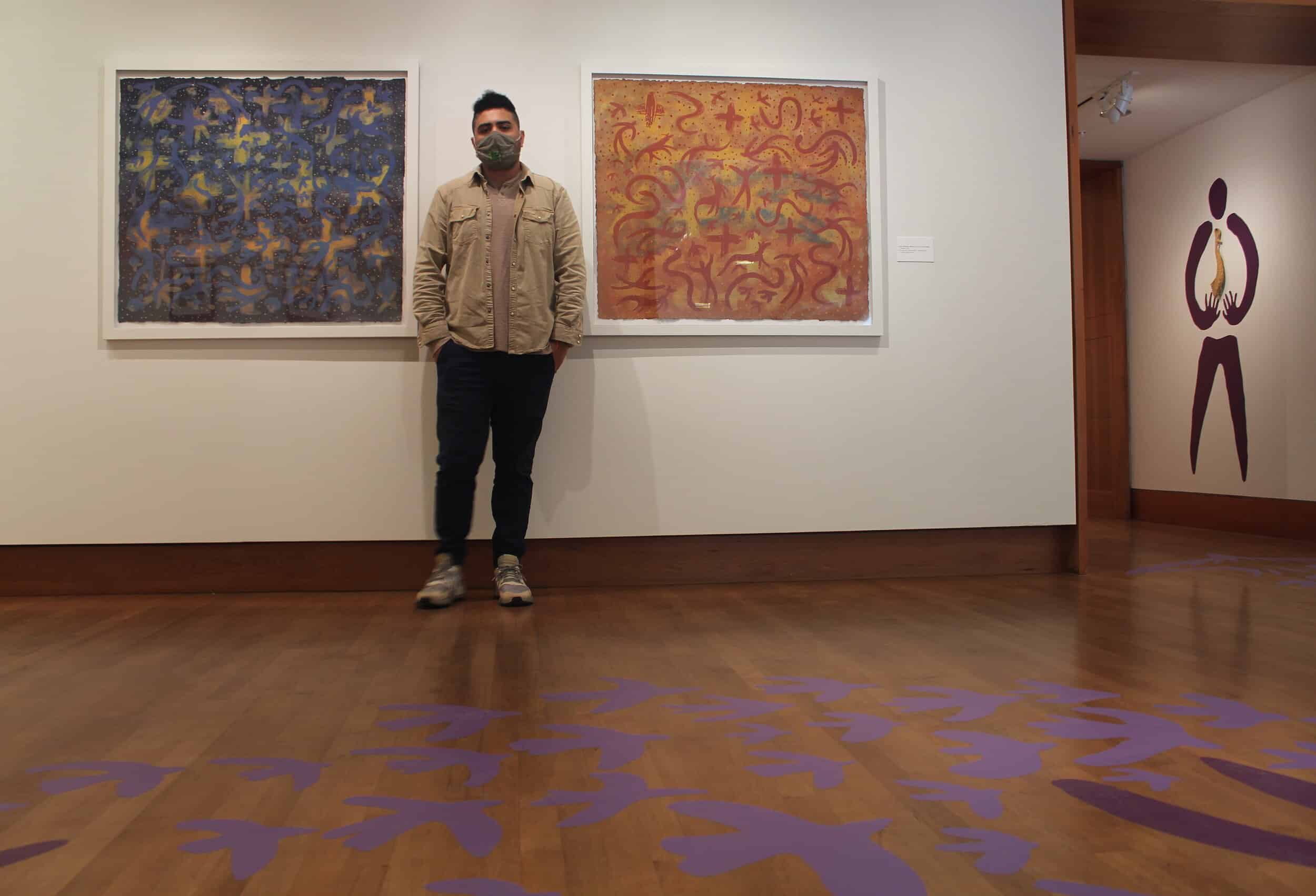 Roberto Torres Mata and his prints “Already Want To Fly” and “You Don’t Have Wings Yet.”
