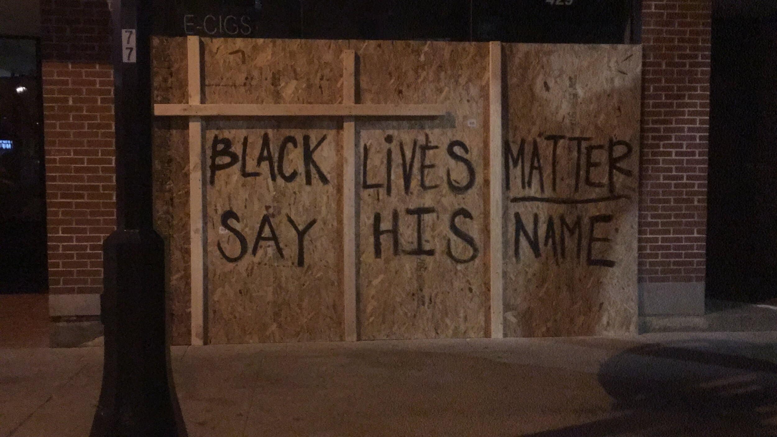 A boarded-up window near the intersection of State and Gilman Streets.