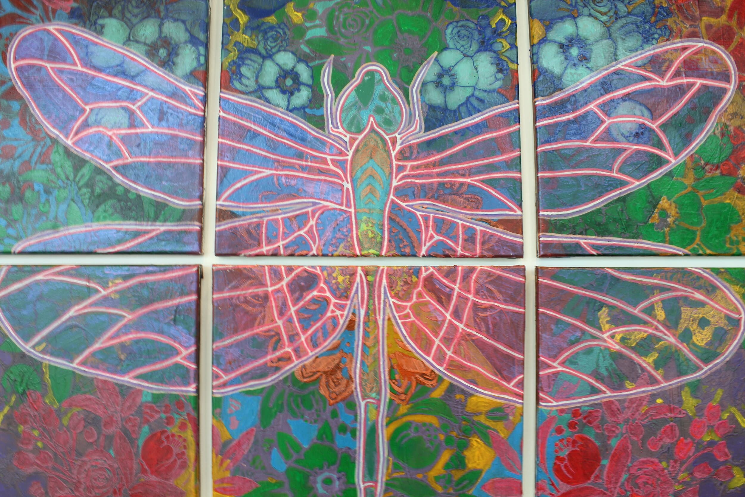 Morales painted six canvases that in unison create a colorful outlined dragonfly.