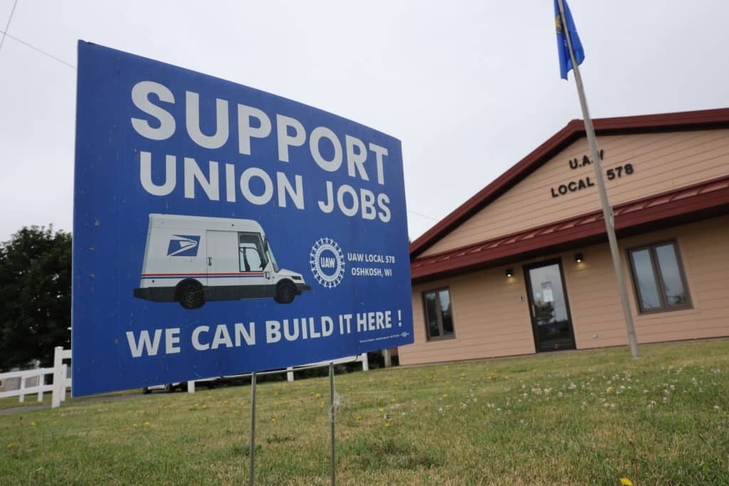 A pro-union sign is seen on the lawn of the United Auto Workers Union building in Oshkosh, Wis., on July 15, 2022. While public sector unions have been decimated by the passage in 2011 of Act 10, efforts are underway around the state to create new private sector unions. (Coburn Dukehart / Wisconsin Watch)