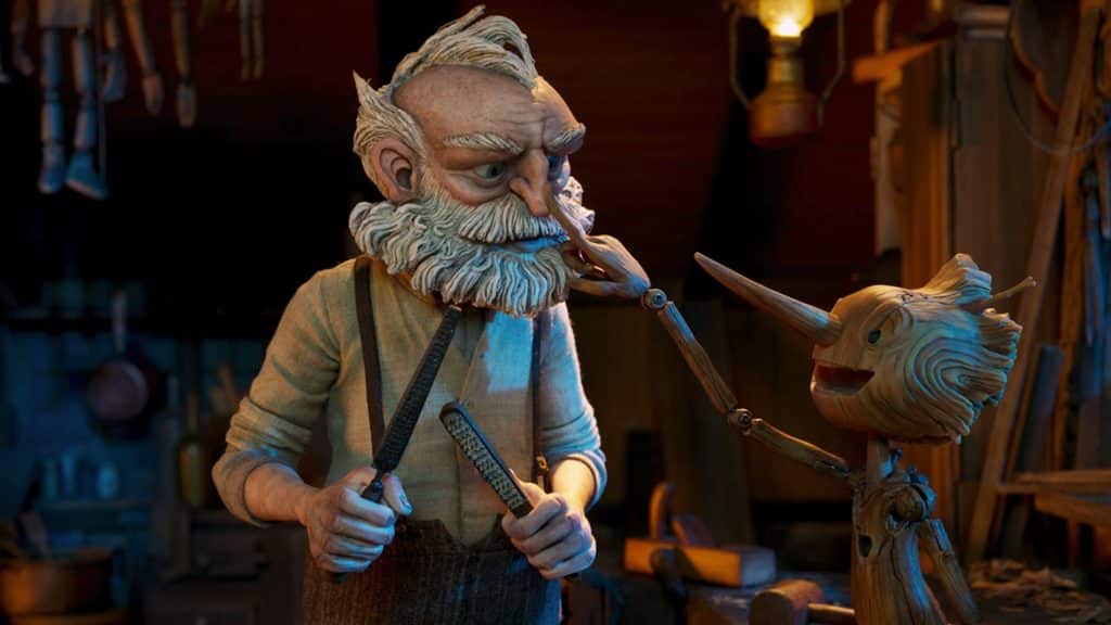 A scene from Guillermo Del Toro's "Pinocchio," featuring Geppetto and the titular wooden boy.