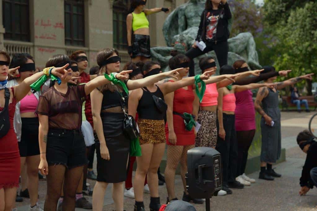 Feminist protesters demonstrate outside the National Stadium in Santiago wearing blindfolds in support of those blinded by police.