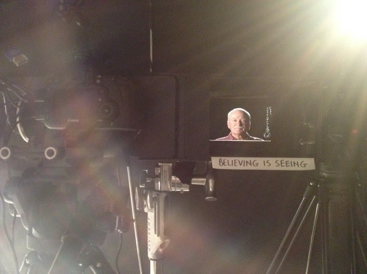 Errol Morris' quote of "Believing Is Seeing" is written on a piece of tape on Neelsen's monitor, which displays the face of interviewee Mike Piaskowski in 2014. Photo by Neelsen.