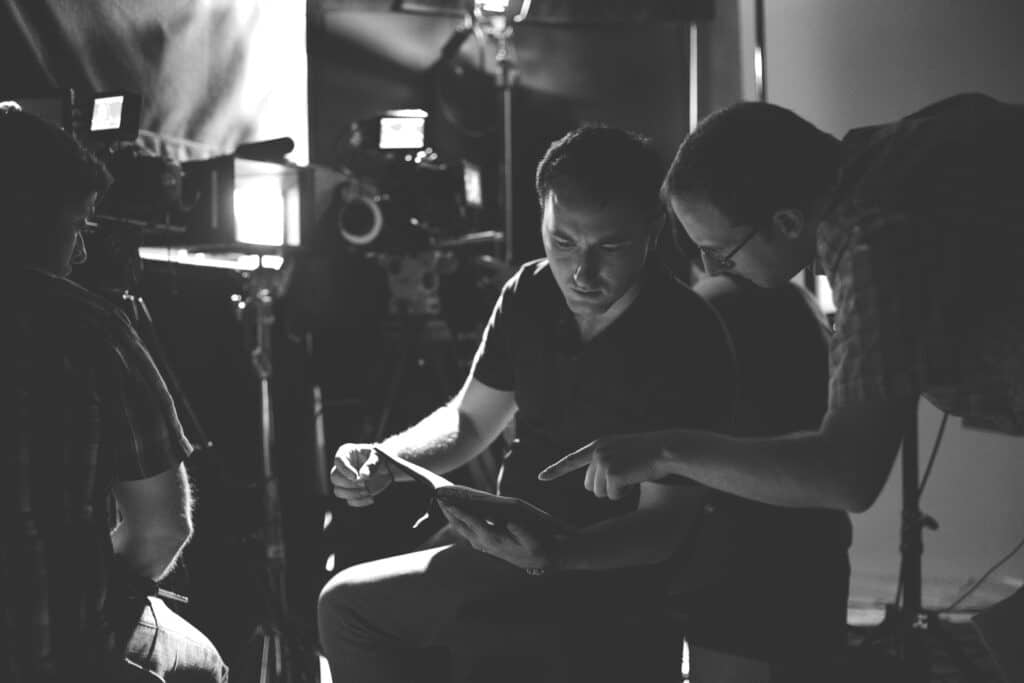Director Michael Neelsen and writer Joe Pudas confer on story notes during a break between interviews in June 2015. Photo by Beth Skogen.