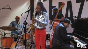 Stylishly dressed in silver and red, Lakecia Benjamin (center) performs "Jubilation" with drummer EJ Strickland, bassist Ivan Taylor, and pianist Zaccai Curtis live at TSF Jazz studio in Paris, France, in late March 2023.