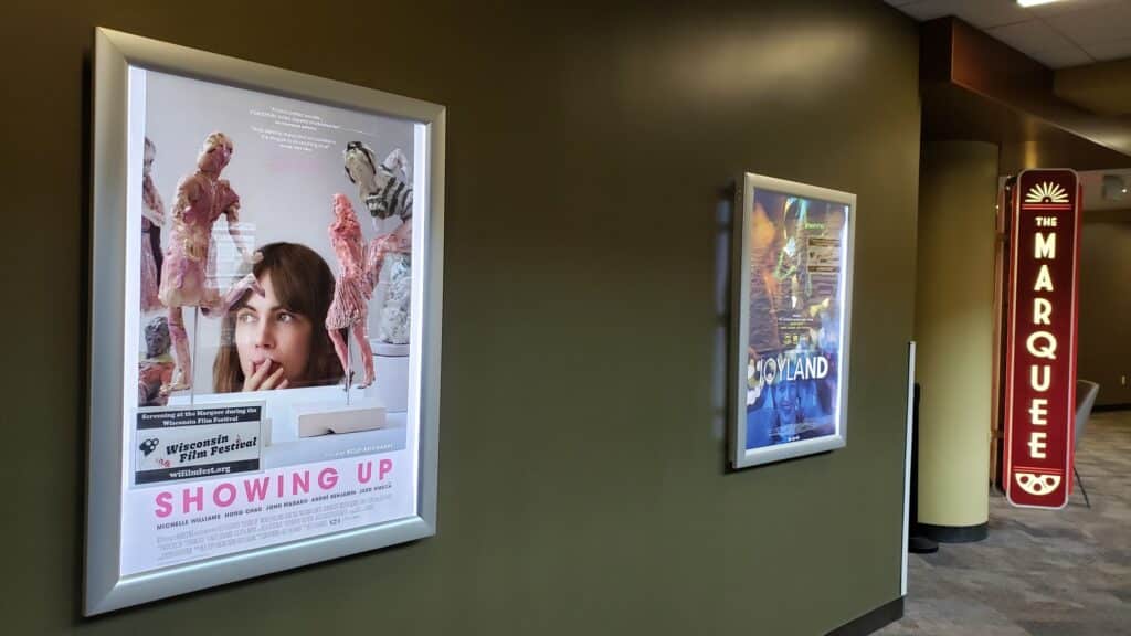 A photo on the second floor of Union South, around the corner from The Marquee Cinema, which displays two posters in lightboxes for Kelly Reichardt's "Showing Up" and Saim Sadiq's "Joyland." Photo by Grant Phipps.