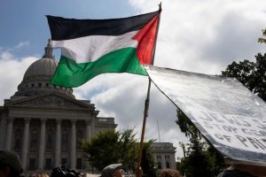 Photo shows a Palestinian flag waving in front of the Wisconsin State Capitol.