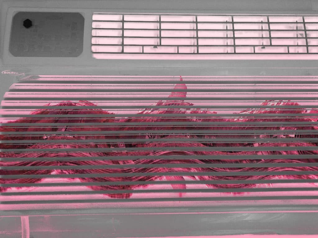 An illustration shows a negative image of a window air-conditioning unit. Overlaid on top of it, visible through the gaps in the unit's grates, is a warped image of the Madison, Wisconsin, skyline.