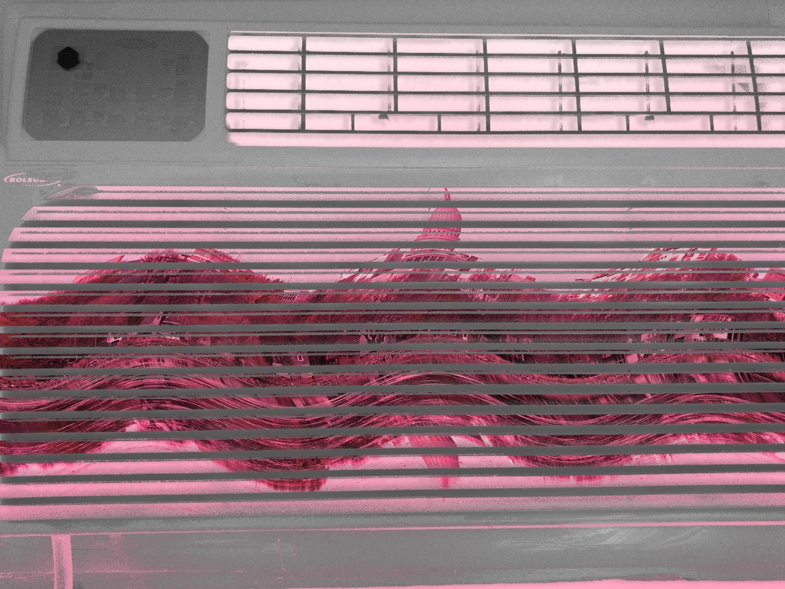 An illustration shows a negative image of a window air-conditioning unit. Overlaid on top of it, visible through the gaps in the unit's grates, is a warped image of the Madison, Wisconsin, skyline.