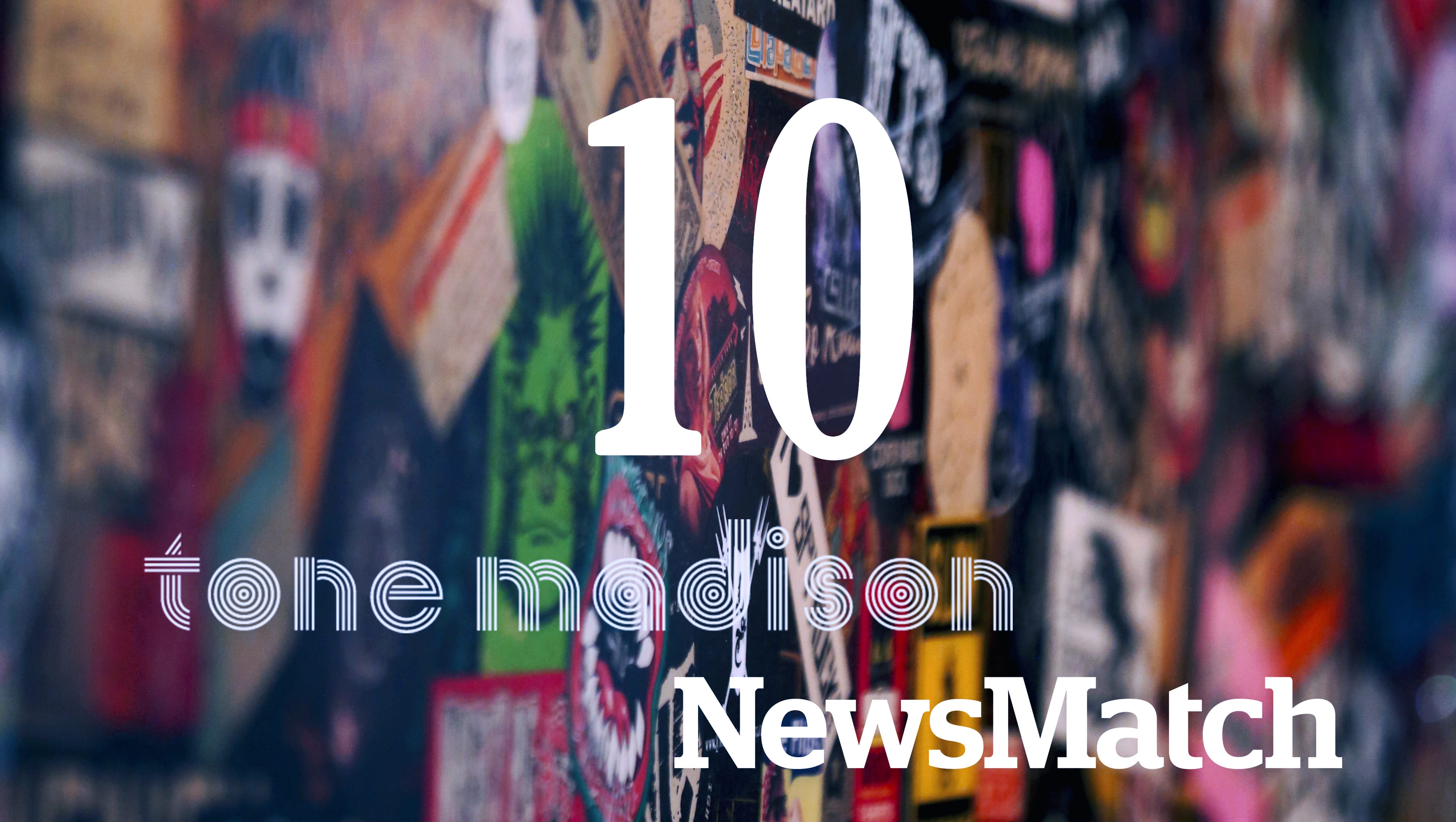 A close-up image of a completely band-stickered bar that Gamma Ray Bar restored from The Frequency, with the number "10" appearing in large text in the center in white. Below it are logos for Tone Madison and NewsMatch.