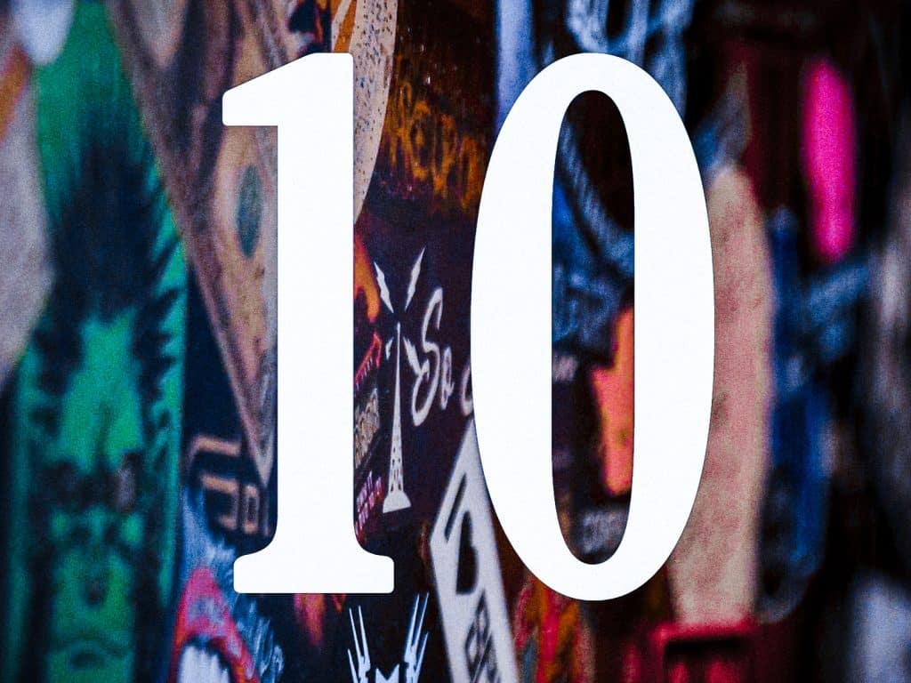 A close-up image of a completely band-stickered bar that Gamma Ray Bar restored from The Frequency, with the number "10" appearing in large text in the center in white. The image is grainy and tinted in a moody blue palette.