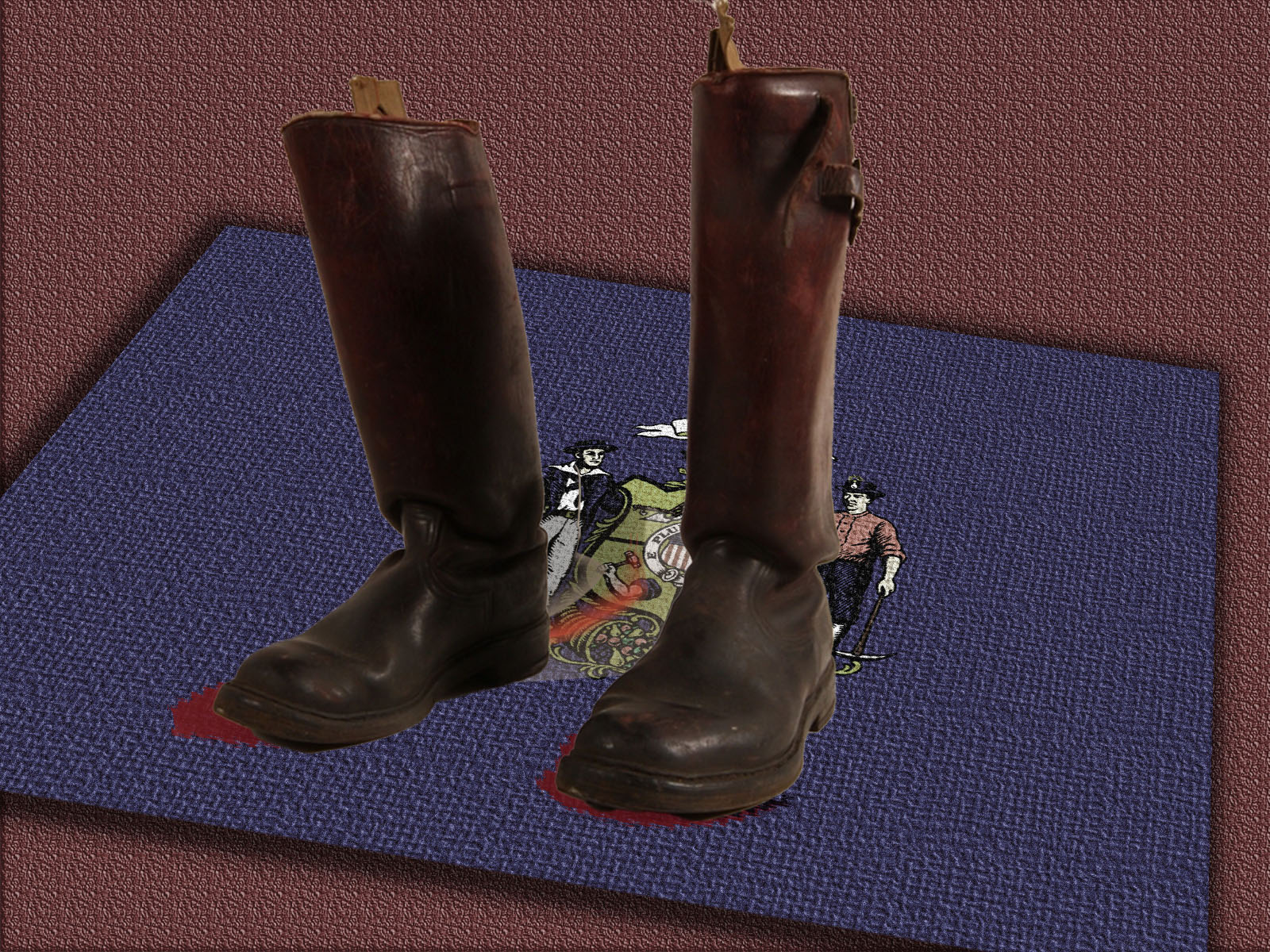 An illustration depicts a weathered doormat made of the Wisconsin state flag, with a pair of jackboots sitting on top of it and bloodstains spreading out from the boots.