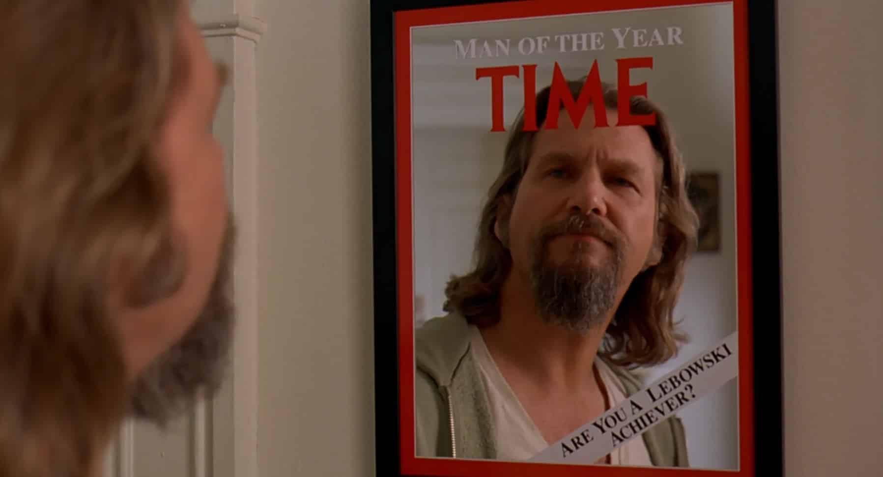 The scruffy "Dude" (Jeff Bridges) stares half-puzzled and half-amused at a mirror on the wall with a red border that reads: "Man of the Year / TIME." In the lower right-hand corner, smaller diagonal text reads: "Are You A Lebowski Achiever?"