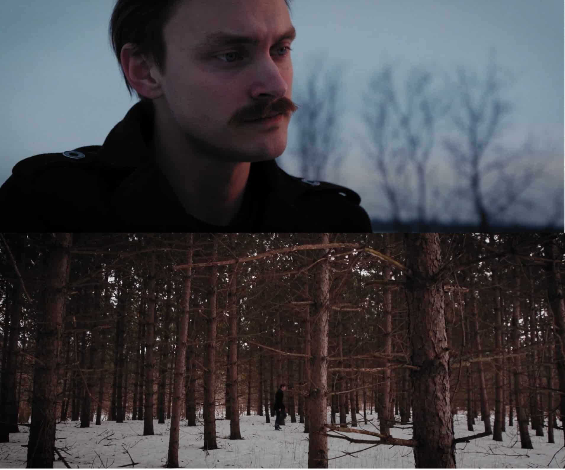 Two screenshots from the "Spark" video are shown stacked. The top image shows Michael Darling positioned to the slight left. He's pensively staring off to the side, wearing a black coat. A pale blue sky and trees can be seen in the background to Darling's right. The bottom image finds Darling in the middle of the screen, walking on snowy ground, a dot amongst the many tall trees.|A screenshot of the "Spark" video shows Michael Darling positioned to the slight left. He's pensively staring off to the side, wearing a black coat. There's a pale blue sky and trees can be seen in the background to Darling's right.
