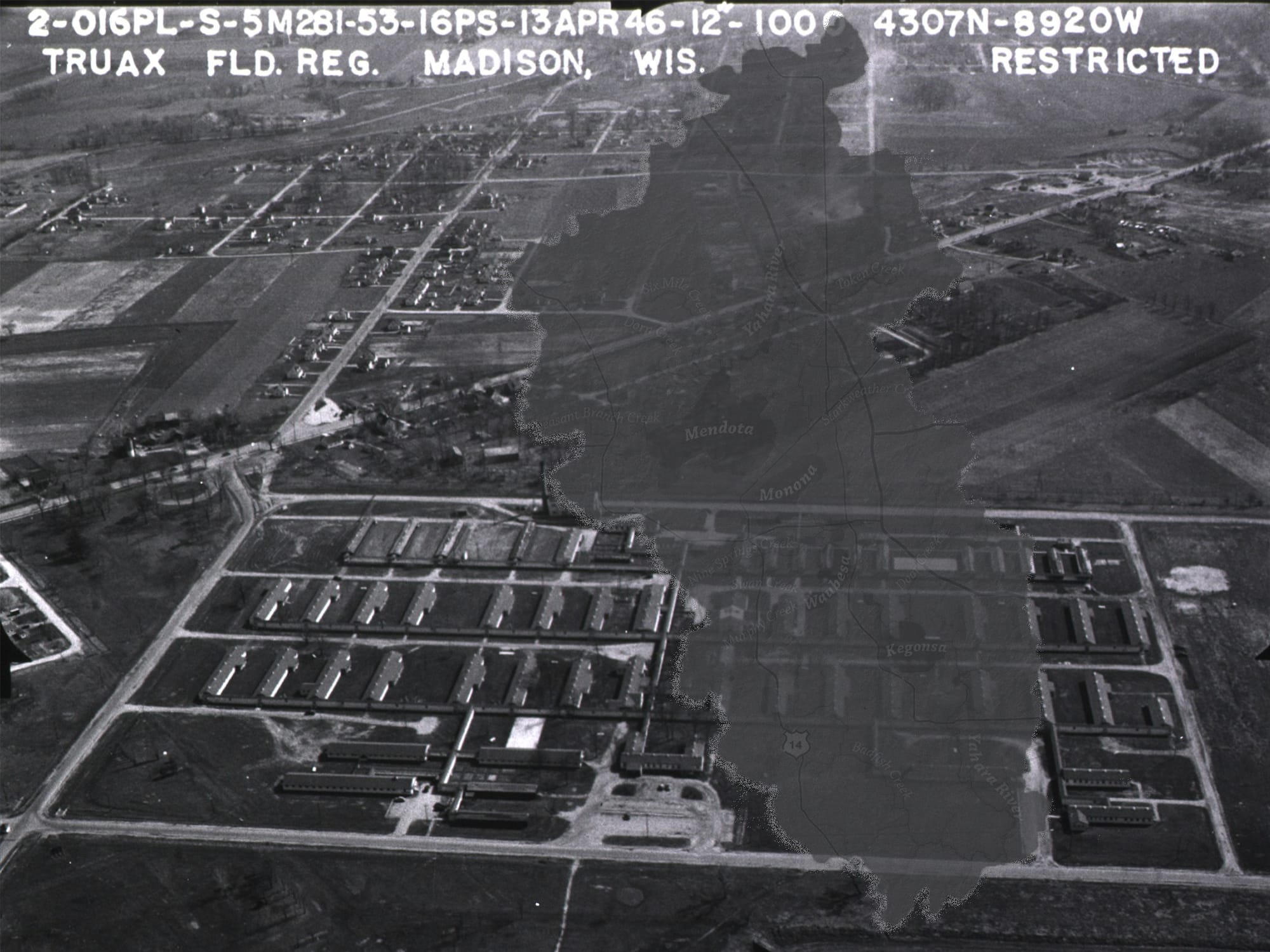A hydrographic map of the Yahara River watershed is shown superimposed on a historic black-and-white aerial photo of Madison's Truax Field.